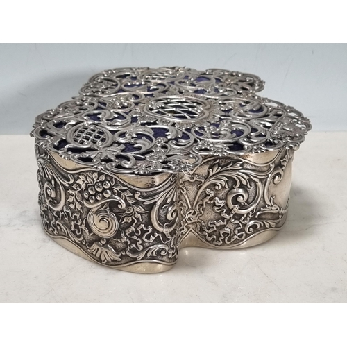 33 - An Edward VII silver Trinket Box, the pierced hinged lid with vase of flowers and floral scrolls, th... 