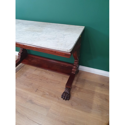 330 - A 19th Century mahogany Console Table with rectangular marble top, raised on carved and scrolled sup... 