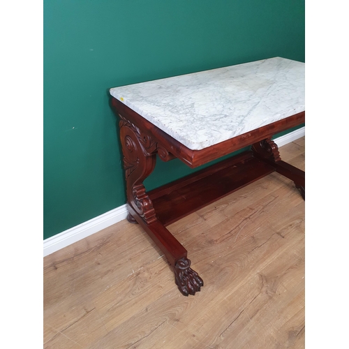 330 - A 19th Century mahogany Console Table with rectangular marble top, raised on carved and scrolled sup... 