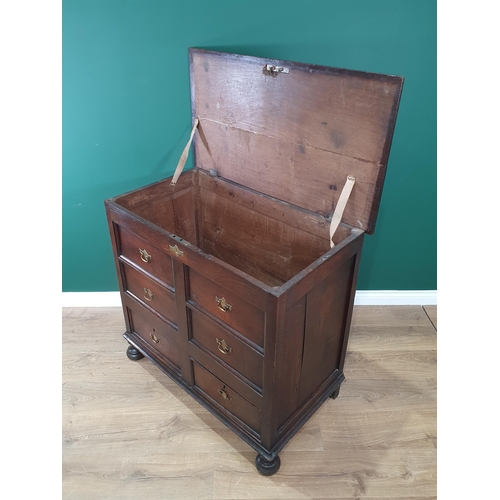 333 - A circa 18th Century oak Mule Chest, the lift up lid above moulded dummy drawer front, with two fitt... 