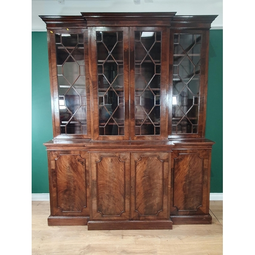 335 - A 19th Century mahogany Breakfront Bookcase fitted four astragal glazed doors enclosing adjustable s... 