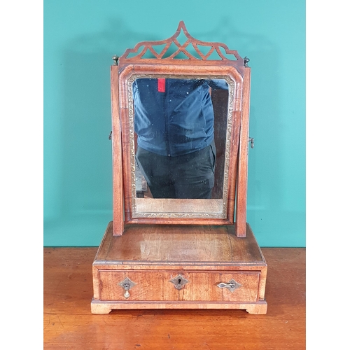 336 - An 18th Century walnut veneered Dressing Mirror with pierced fret surmount and gilded slip above box... 