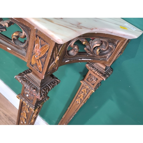 341 - A gilt carved wood Pier Table with shaped marble top above a leafage pierced scrolled frieze, raised... 