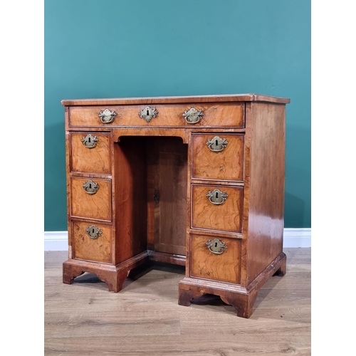 348 - An 18th century walnut Kneehole Desk with cross-banded, quarter veneered and herringbone line inlaid... 