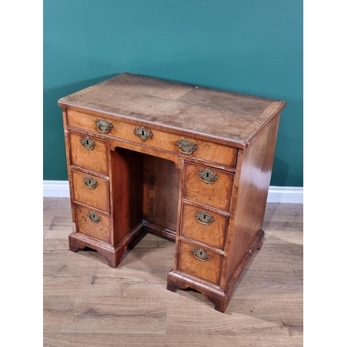 348 - An 18th century walnut Kneehole Desk with cross-banded, quarter veneered and herringbone line inlaid... 