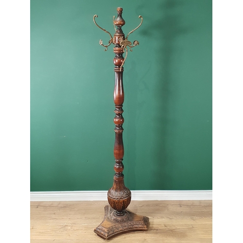 352 - A Victorian mahogany Hat Stand with turned column and carved triangular base