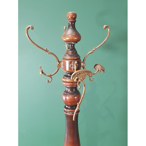 352 - A Victorian mahogany Hat Stand with turned column and carved triangular base