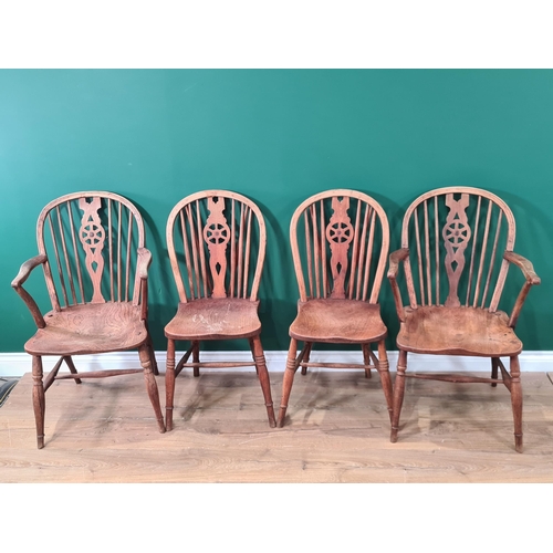 369 - Four similar 19th century Windsor Dining Chairs in ash, elm, yew, etc with wheelbacks, solid seats o... 