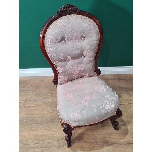 372 - A Victorian Nursing Chair with pink and grey floral button upholstered back on cabriole front legs a... 