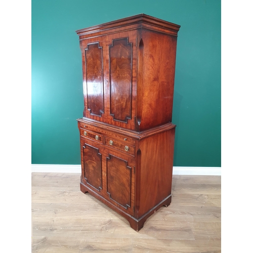 376 - A reproduction mahogany Cocktail Cabinet with pair of solid panelled doors above brushing slide, two... 