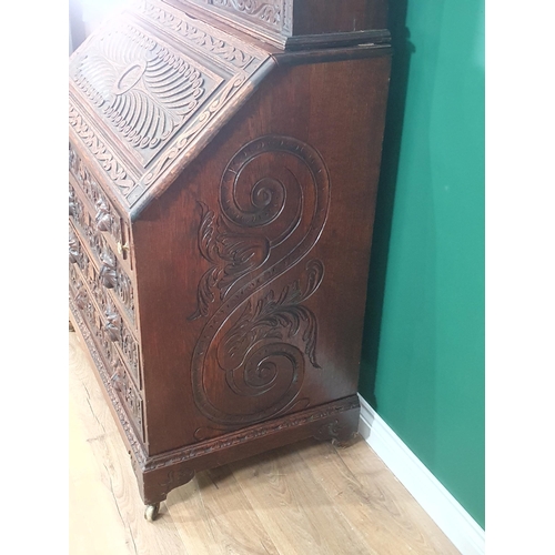 381 - A Victorian carved oak Bureau Bookcase with pair of astragal glazed doors, 3ft