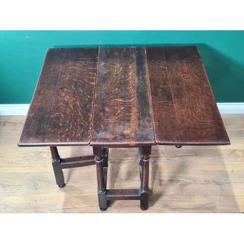 383 - An early 18th Century oak Gate-leg Table with rectangular drop leaves on turned and square legs unit... 