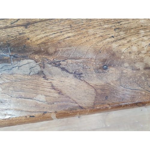 388 - An 18th century French Farmhouse Table with cleated oak three plank top on square tapering legs, 7ft... 