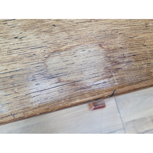 388 - An 18th century French Farmhouse Table with cleated oak three plank top on square tapering legs, 7ft... 