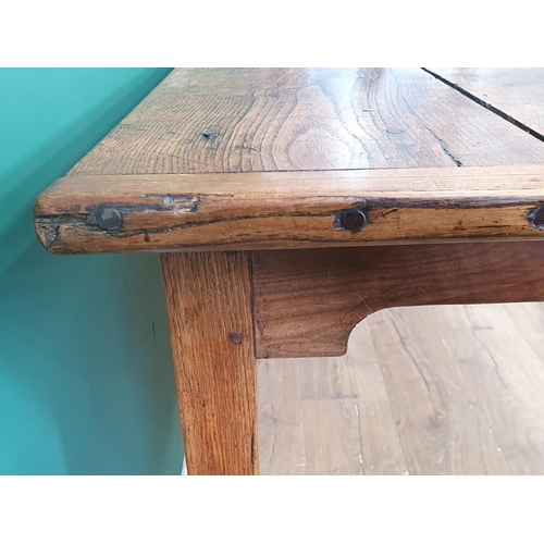 388 - An 18th century French Farmhouse Table with cleated oak three plank top on square tapering legs, 7ft... 