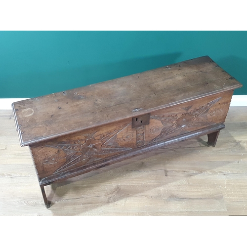 390 - A 17th century oak Plank Chest with rosette and leafage star carved front beneath iron lock plate, 4... 