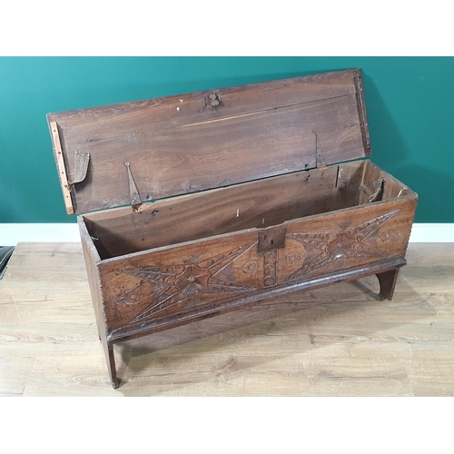 390 - A 17th century oak Plank Chest with rosette and leafage star carved front beneath iron lock plate, 4... 