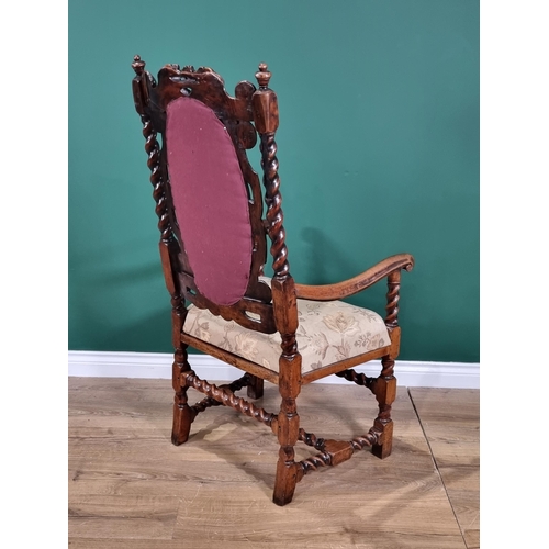 393 - An antique Queen Anne style walnut open Armchair with peach floral upholstered oval back panel and s... 