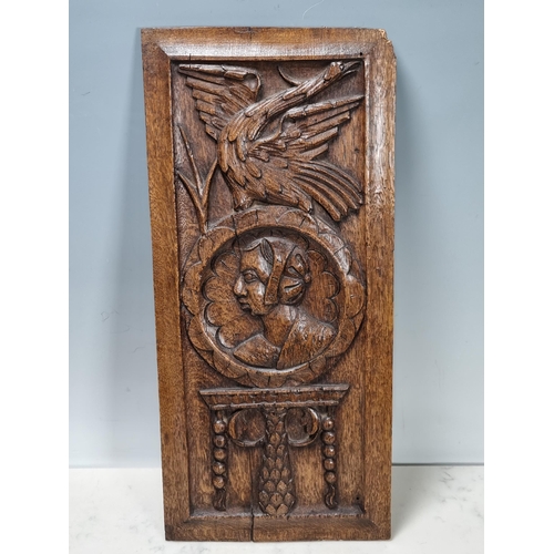 400 - A pair of 16/17th century carved oak Portrait Panels with man and woman surmounted by bird, 17 x 8in