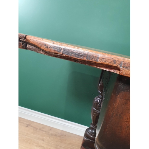 402 - An antique oak Refectory Table in the 17th Century style with two plank cleated top, carved friezes ... 