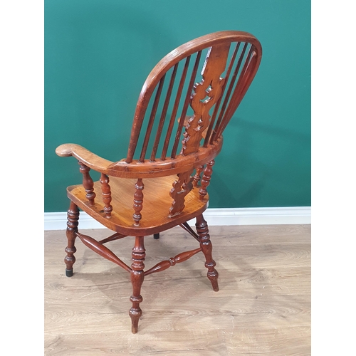 416 - A 19th Century ash and elm Windsor style Kitchen Armchair with pierced splat back and scroll arms ra... 