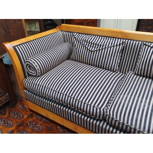 417 - A Biedermeier style two seater Settee with scrolled arms, raised on squared tapering supports and wi... 