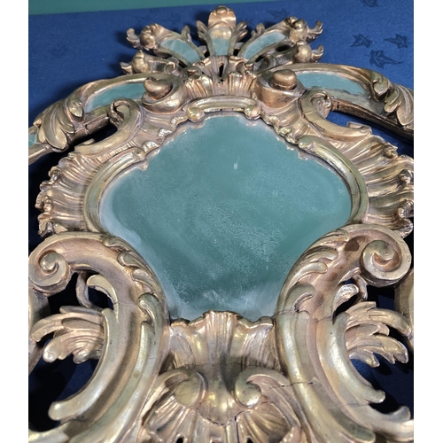 418 - An 18th Century gilt pediment Mirror/Door Pediment with bevelled mirror panels set amongst a design ... 