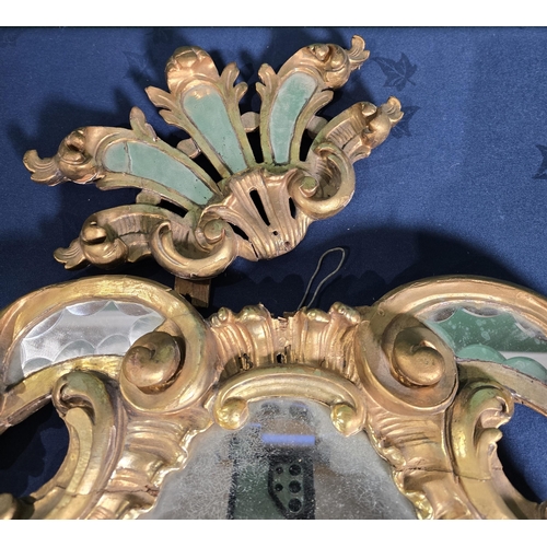 418 - An 18th Century gilt pediment Mirror/Door Pediment with bevelled mirror panels set amongst a design ... 