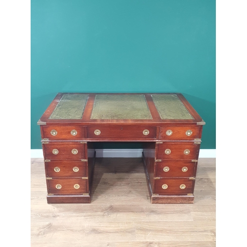 422 - A Campaign style mahogany brass bound Kneehole Desk wit green inset leather top above nine drawers w... 