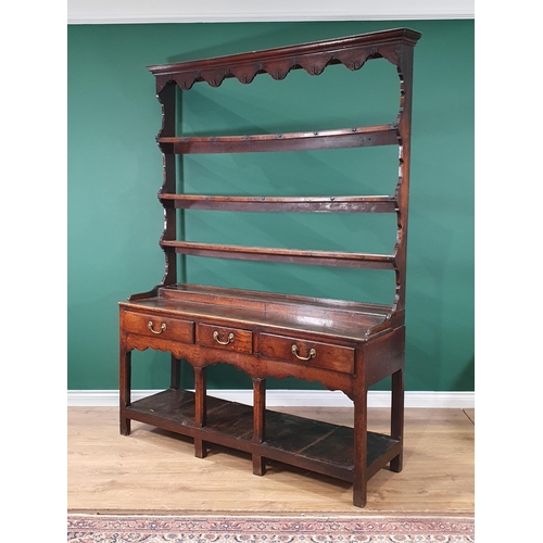 423 - An 18th Century Welsh oak Pot board Dresser and Rack the base fitted three drawers above Cupid's bow... 