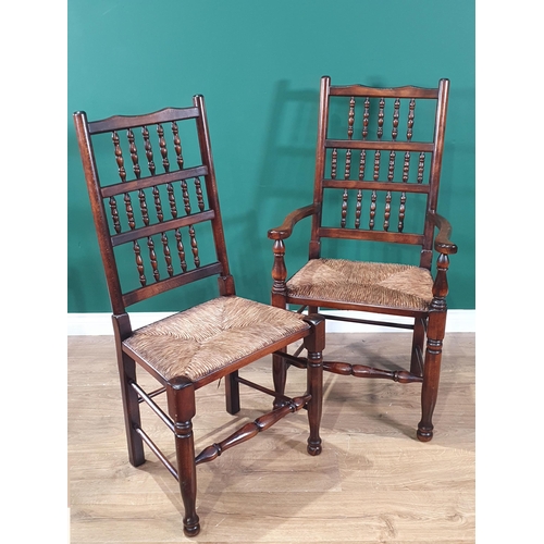 429 - A set of six spindle back Dining Chairs with rush seats on turned supports and stretchers; two Carve... 