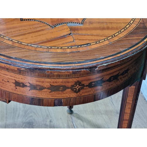 434 - An Edwardian rosewood and crossbanded oval Side Table with segmented centre and raised on squared ta... 