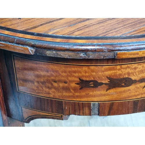 434 - An Edwardian rosewood and crossbanded oval Side Table with segmented centre and raised on squared ta... 