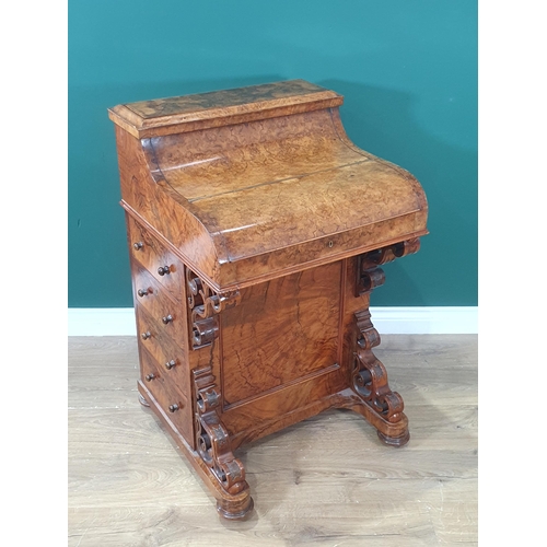 436 - A Victorian burr walnut veneered Davenport with rise and fall stationery compartment above lift-up l... 