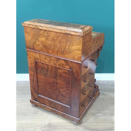 436 - A Victorian burr walnut veneered Davenport with rise and fall stationery compartment above lift-up l... 