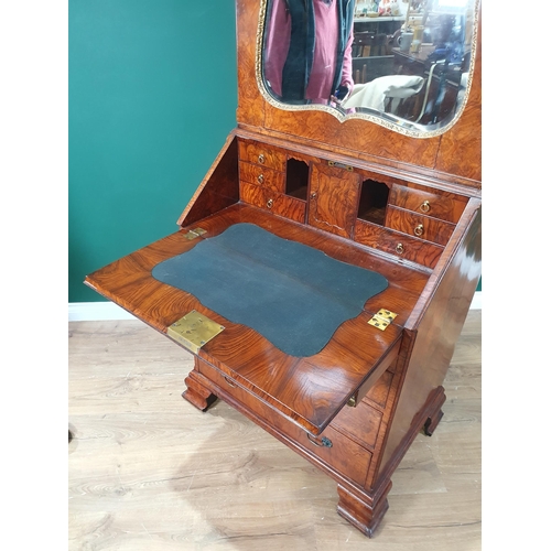 438 - A 19th Century George II style burr walnut Bureau Bookcase, the architectural cornice above a mirror... 