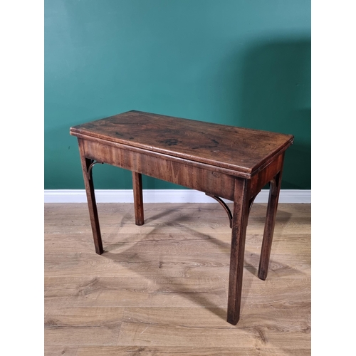 448 - A Georgian mahogany Card Table with foldover rectangular top, supported on a concertina action and r... 