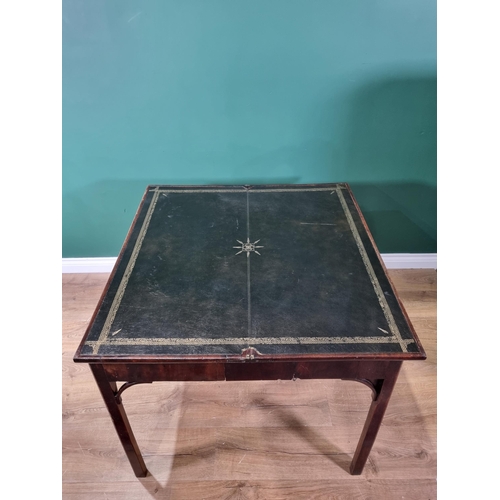 448 - A Georgian mahogany Card Table with foldover rectangular top, supported on a concertina action and r... 