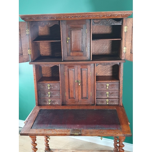 450 - A Victorian carved oak Secretaire Cabinet with pair of doors enclosing small cupboard above fall fro... 