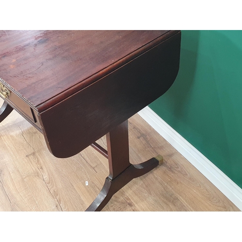 451 - A Regency mahogany Sofa Table fitted two drawers on cheval frame with down swept feet having brass t... 