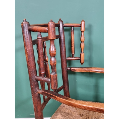 465 - A 19th century turned ash Armchair with turned spindle wings, shaped arms turned and squared support... 