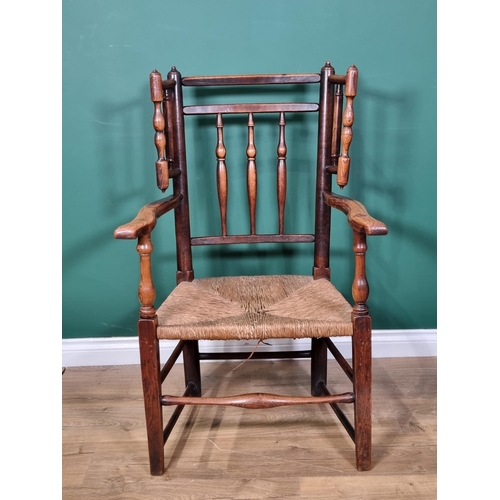 465 - A 19th century turned ash Armchair with turned spindle wings, shaped arms turned and squared support... 