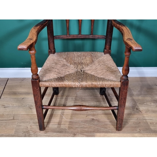 465 - A 19th century turned ash Armchair with turned spindle wings, shaped arms turned and squared support... 