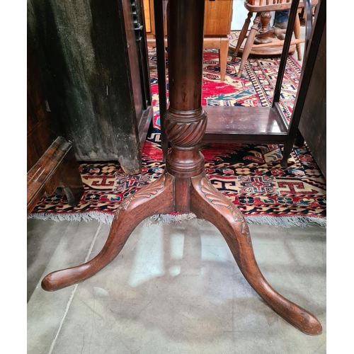 473 - A George III mahogany tilt-top Table, the circular top with piecrust rim, on turned column and splay... 