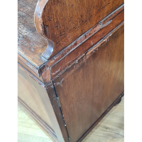 478 - A 19th Century mahogany Waterfall Bookcase, the shelves with shaped supports, above pair of panelled... 