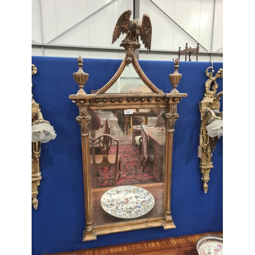 484 - An 18th Century gilt Wall Mirror, with Eagle mirrored surmount and the rectangular mirror plate flan... 