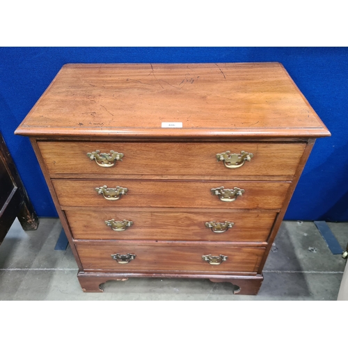 486 - A small 19th Century walnut Chest of four long graduated Drawers raised on shaped bracket supports, ... 