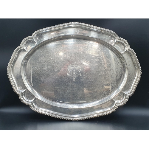 50 - A George V silver large oval Tray with gadroon rim, engraved ornate coat of arms and initials, Londo... 