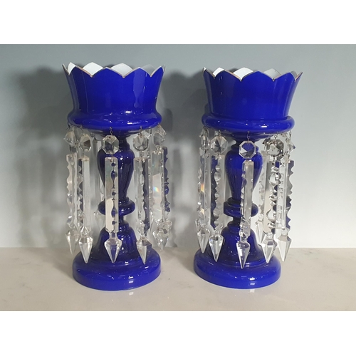 535 - A pair of blue and white opaline glass Table Lustres with clear glass prism drops, 13 1/2in