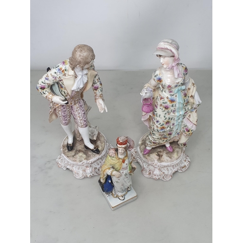 542 - A pair of continental Figures of a gentleman and lady dressed in matching floral and gilt roses and ... 